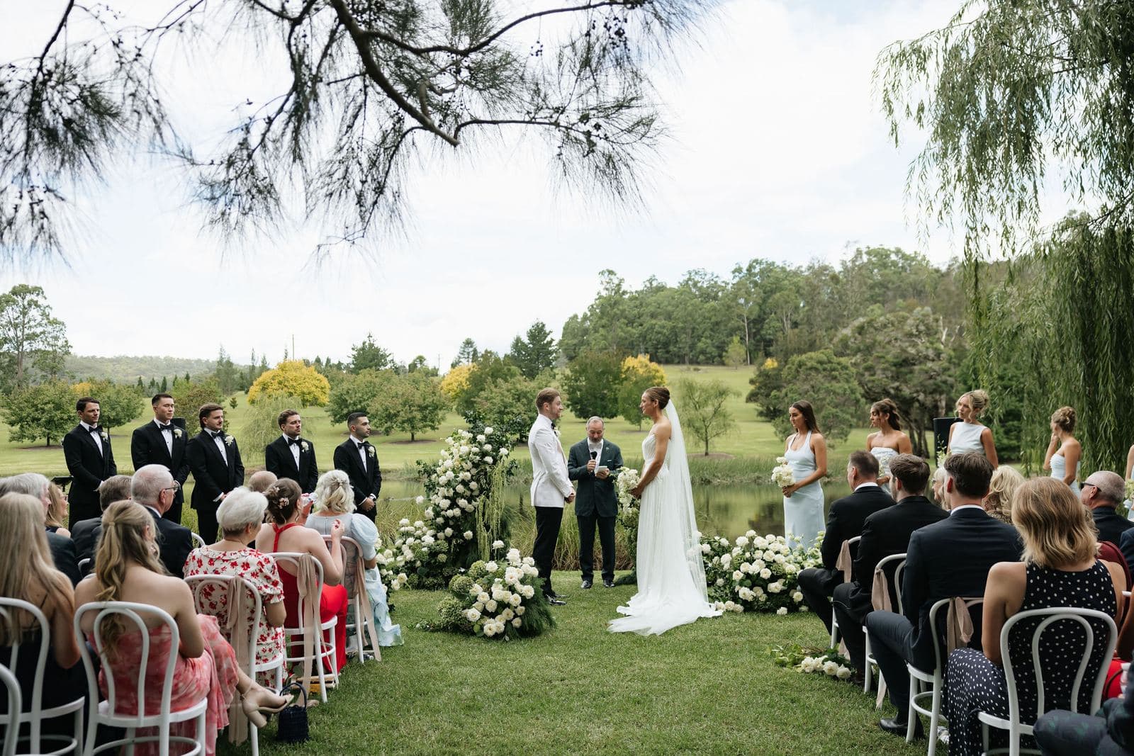 Wedding ceremony in progress on a country lawn